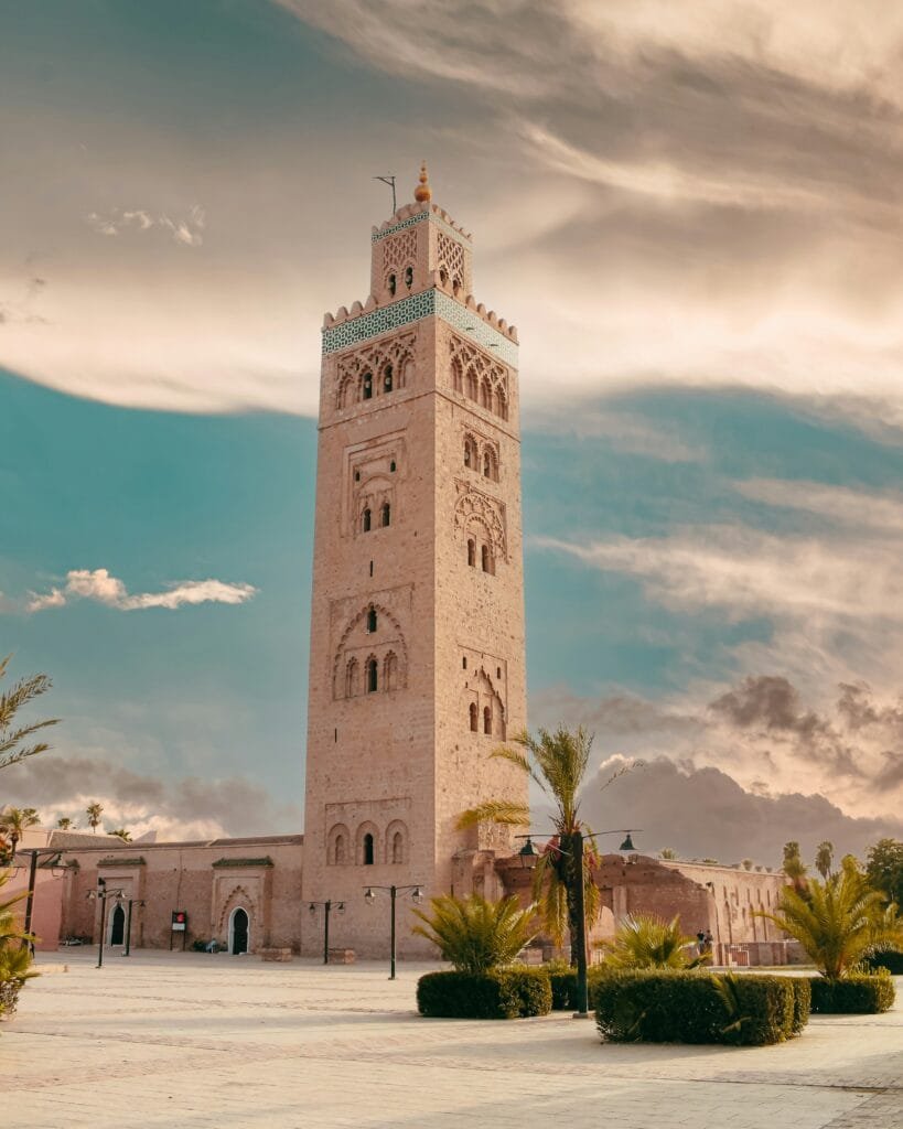 Koutoubia Mosque minaret in Marrakech under a cloudy sky