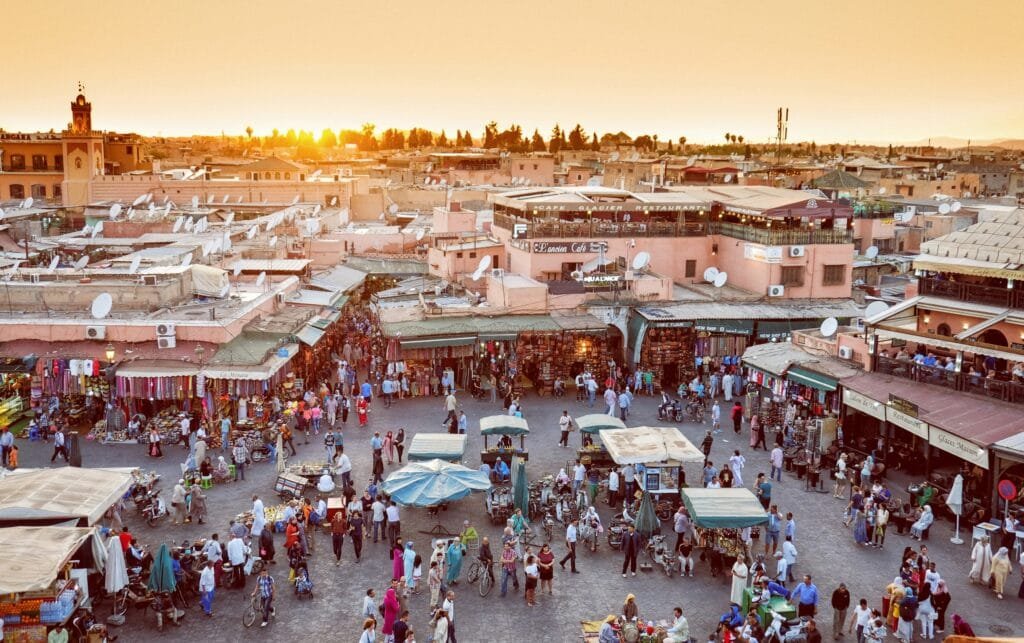 Marrakech travel guide: Jemaa el-Fna square at sunset from a rooftop cafe